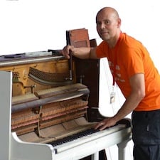 Pete the piano man tuning a piano